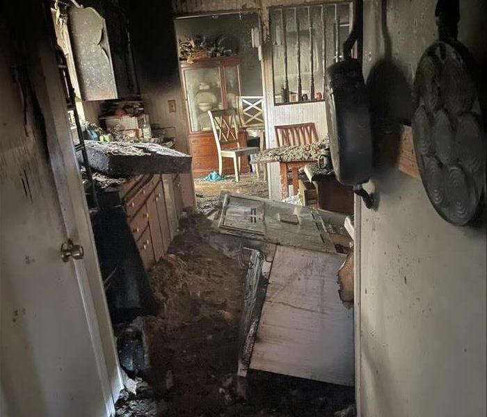 Local kitchen endures fire damage after complete home is engulfed in flames.
