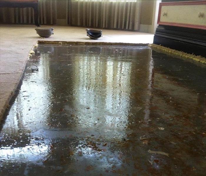 Tallahassee room with standing water in a cut away floor