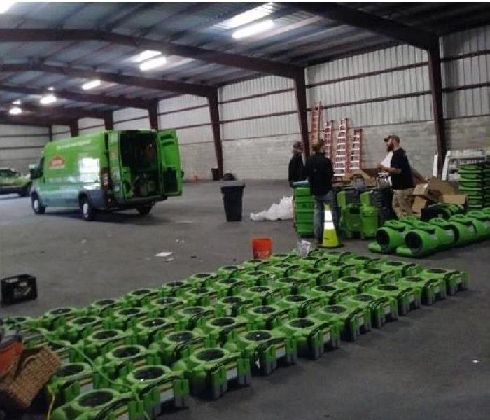Inside of SERVPRO storage facility. Equipment being loaded into van.